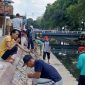Foto: Warga RT 004 Pabian bergotong royong membersihkan bantaran Sungai Marengan jelang HUT ke-80 RI.
