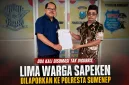 Foto: Kuasa hukum Rahman, S.H., bersama pelapor Subandrio (kanan) menunjukkan salinan laporan polisi usai melaporkan dugaan penggelapan hak atas tanah di SPKT Polresta Sumenep, Sabtu (18/7/2026).